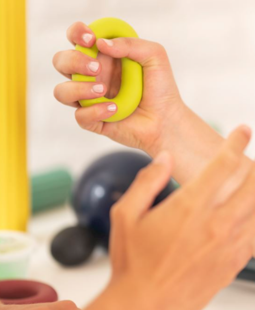 Patient completing a hand rehabilitation activity during occupational therapy