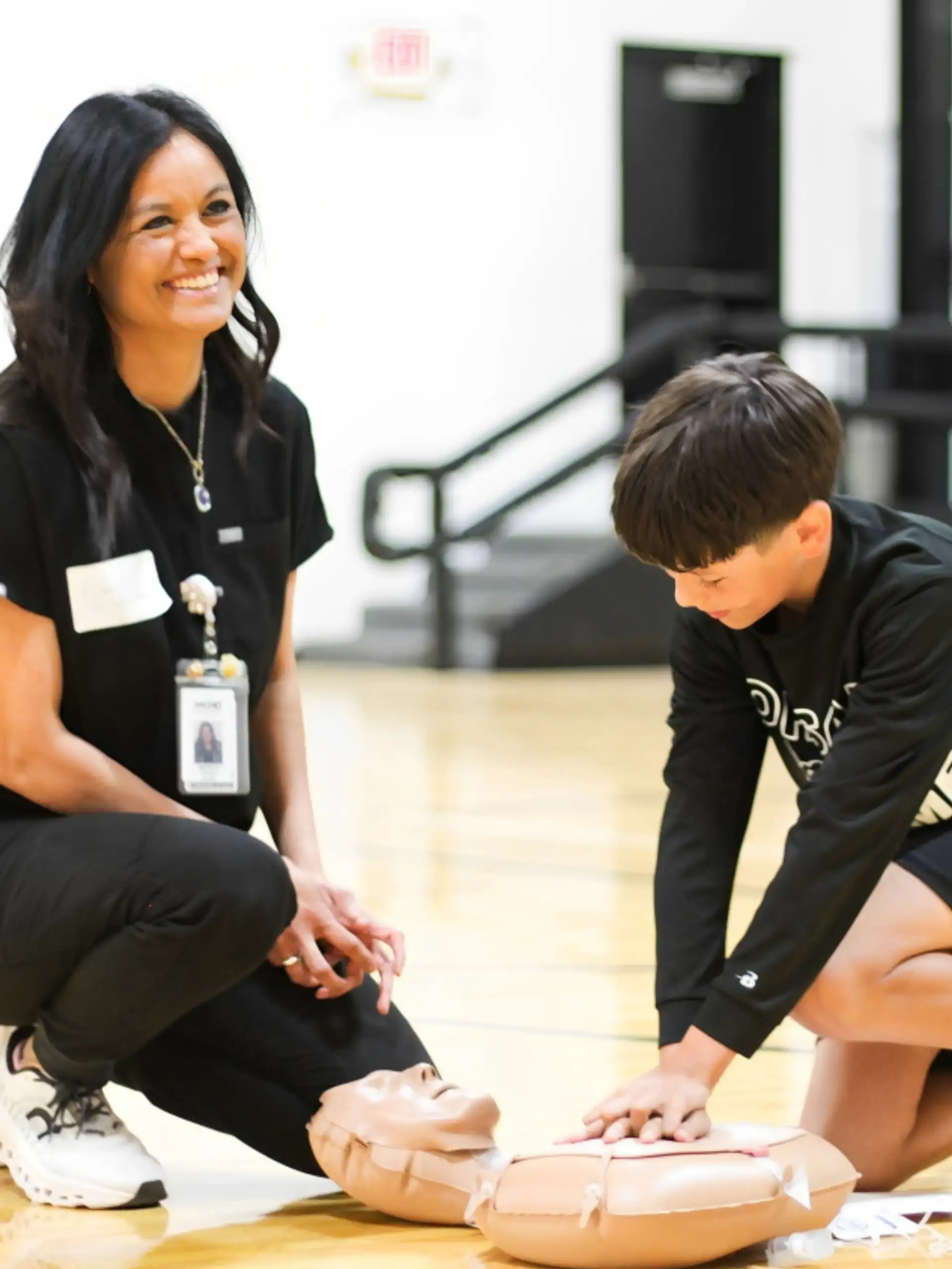 Students practicing CPR during a class led by Martin County Hospital District staff