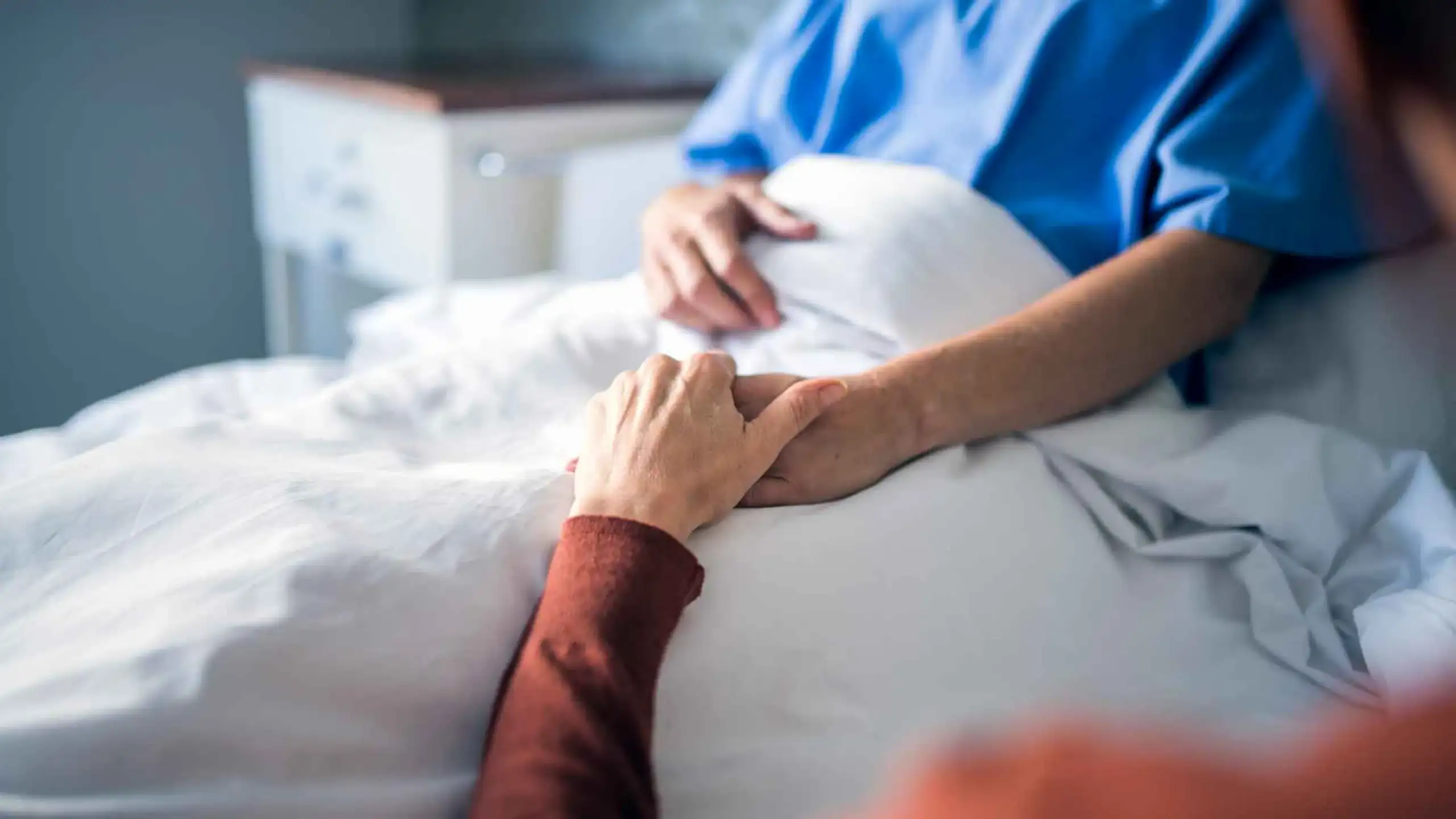 Nurse assisting an older patient
